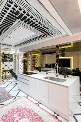 a kitchen with a white counter and a sink at Une Galerie Dans Le ciel - Hivernage Marrakech in Marrakech