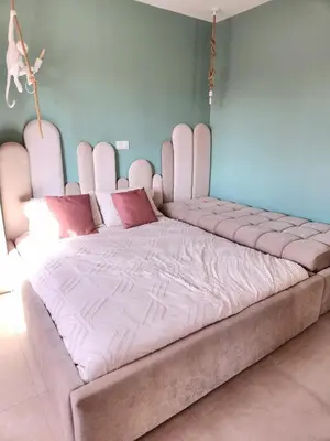 a large bed with a pink headboard in a room at Villa ilyana, Atlas Villa in Marrakech