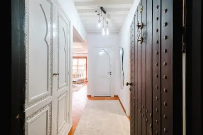 a hallway with a white door and a hallway with a hallwayngth at Cozy Studio Well Located Near Gueliz in Marrakech
