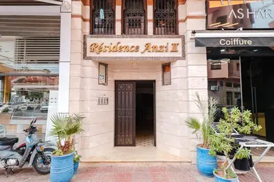 a building with a motorcycle parked in front of it at Cozy Studio Well Located Near Gueliz in Marrakech