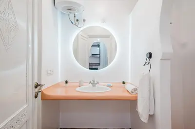 a bathroom with a sink and a mirror at Cozy Studio Well Located Near Gueliz in Marrakech
