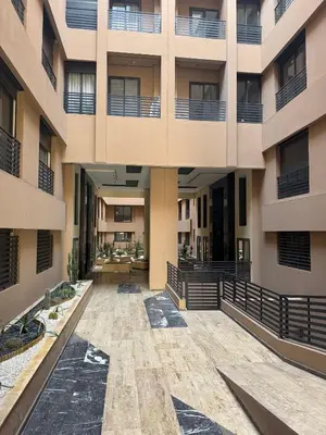 an empty courtyard of an apartment building at Appartement Plaza Sunset in Marrakech