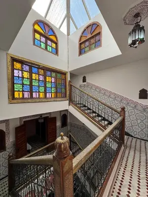 an image of a staircase with stained glass windows at ASA House in Marrakech