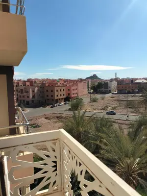 a balcony with a view of a city at Appartement Confort & Style à Charaf - Marrakech in Marrakech
