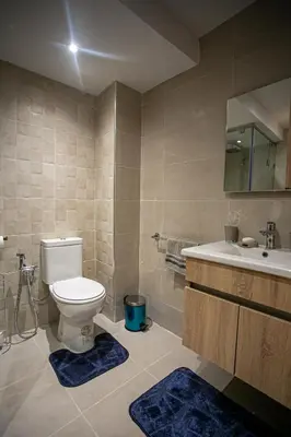 a bathroom with a toilet and a sink at Duplex Majorella in Marrakech