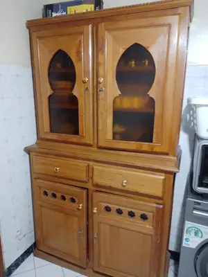 a large wooden hutch with two doors at Riad avec jardins et piscines in Marrakech