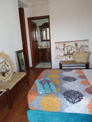a bedroom with a bed with two towels on it at Modern Gueliz Apartment with Private Pool, Near to Train Station in Marrakech