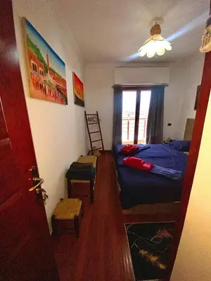 a small bedroom with a bed and a window at Modern Gueliz Apartment with Private Pool, Near to Train Station in Marrakech