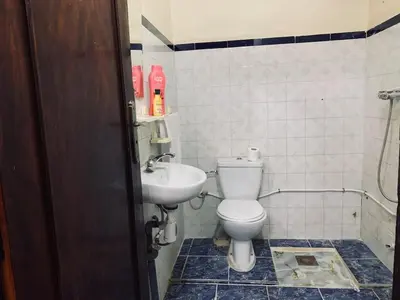 a bathroom with a toilet and a sink at 120m2, Centre Marrakech, Traditional in Marrakech