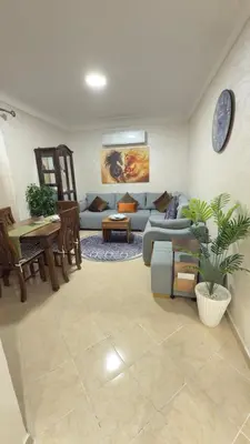 a living room with a couch and a table at Just renovated appartement in marrakech in Marrakech
