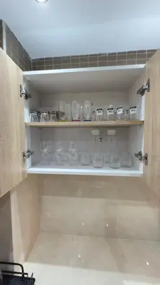 a cupboard filled with lots of glasses and bowls at Just renovated appartement in marrakech in Marrakech