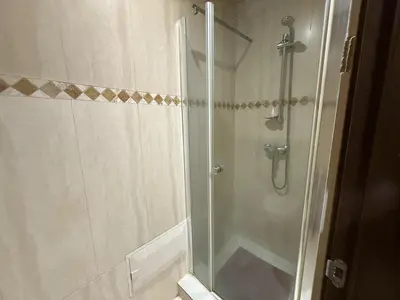 a shower with a glass door in a bathroom at Prestigious Villa in Marrakesh in Marrakech