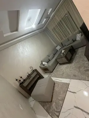 an overhead view of a living room with a couch at Appartement cozy in Marrakech