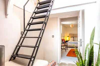 a ladder leaning against a wall in a room at dar dmana in Marrakech