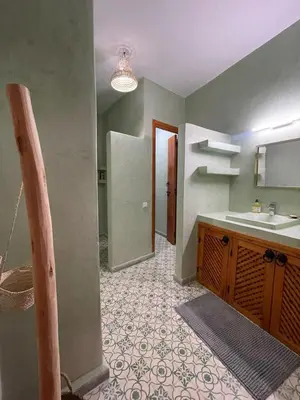 an empty bathroom with a sink and a counter at Riad de luxe PAMA au cœur de la médina Marrakech in Marrakech