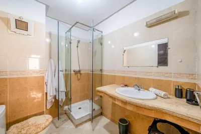 a bathroom with a sink and a shower at Cocon De Luxe Proche du Centre in Marrakech