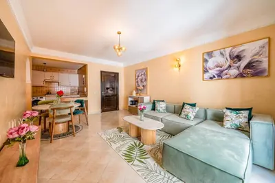 a living room with a couch and a table at Cocon De Luxe Proche du Centre in Marrakech