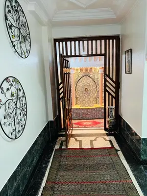 an entrance to a room with a large wooden door at Les 3 SOEURS MAJORELLE in Marrakech