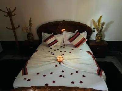 a bedroom with a large bed with hearts on it at Les 3 SOEURS MAJORELLE in Marrakech