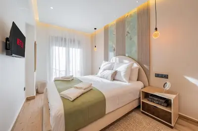 a bedroom with a large white bed and a window at Cosy and fully equipped 2bed appt in Gueliz in Marrakech