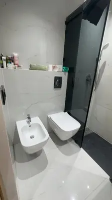 a bathroom with a toilet and a sink and a shower at Appartement a marrakech gueliz au centre ville in Marrakech