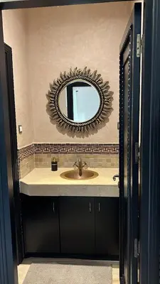 a bathroom with a sink and a mirror at Villa Oasis Marrakesh in Marrakech