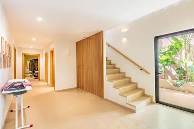 a hallway of a house with stairs and a window at Villa Aila Elegant 6 Bedrooms Spa, Cinema Pool in Marrakech