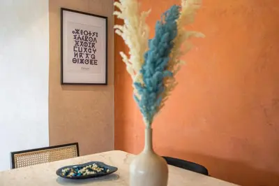 a vase sitting on top of a table at Charme Marrakchi - Piscine, Jardin & Espace Sport in Marrakech