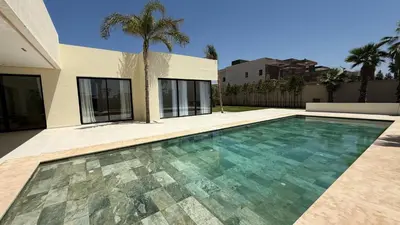 a swimming pool in front of a house at Villa Enja - Swimming pool - 4 BR BA - Wi-Fi - Parking in Marrakech