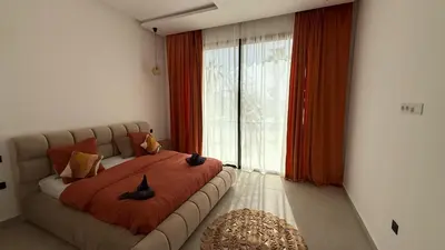 a bedroom with a bed with two cats on it at Villa Enja - Swimming pool - 4 BR BA - Wi-Fi - Parking in Marrakech