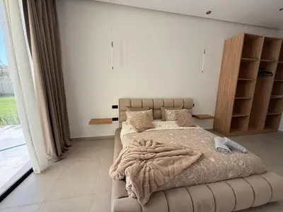 a bedroom with a bed and a large window at Villa Enja - Swimming pool - 4 BR BA - Wi-Fi - Parking in Marrakech