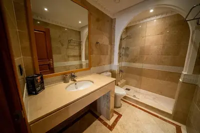 a bathroom with a sink and a shower at luxury gueliz in Marrakech