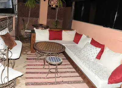 a living room with a couch and a table at Naima's House in Marrakech