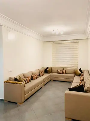 a living room with two couches in a room at Spacious apartment 15 minutes from aéroport Marrakech reservation juste pour les familles est les couples mariés in Marrakech