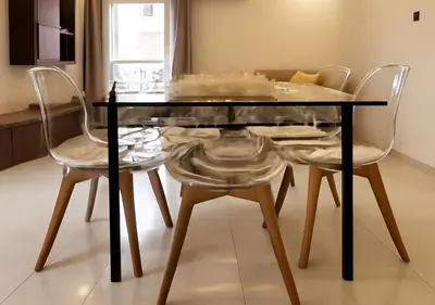 a glass table with two chairs and a dining room at Walili 1 in Marrakech