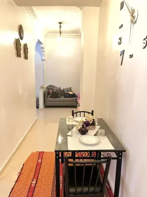 a table with a plate on it in a room at luxury marrakech in Marrakech