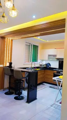 a kitchen with a sink and a counter top at شقة مفروشة in Marrakech