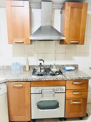 a kitchen with a stove with a pot on it at Apprt luxueux l'Hivernage au centre ville proche de la gare ,M avenu CR07 in Marrakech