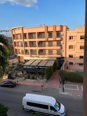 a white van parked in front of a building at Apprt luxueux l'Hivernage au centre ville proche de la gare ,M avenu CR07 in Marrakech