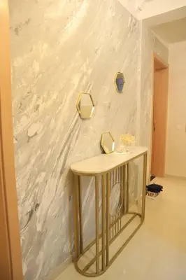 a table in a room with a white wall at Apartment 5 minutes from Marrakech Airport in Marrakech