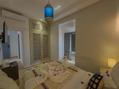 a room with a cake on a bed at Riad Tonaroz Gold in Marrakech