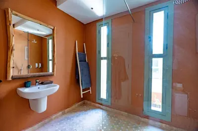 a bathroom with a sink and a shower at Riad 26 in Marrakech