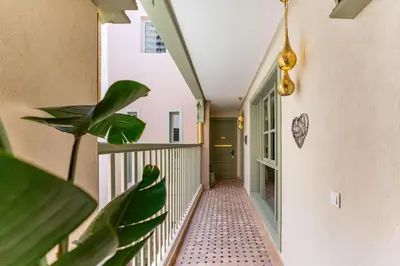 a hallway of a house with a plant at Riad 26 in Marrakech