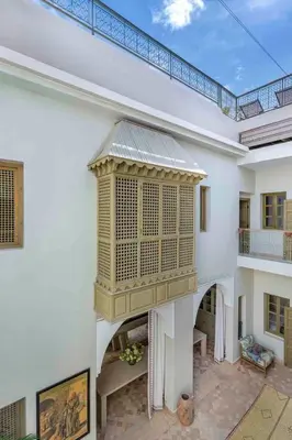 a large white house with a large balcony at Riad Bayda in Marrakech