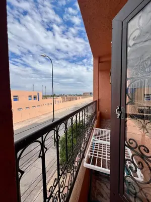 a balcony with a view of the beach at Appartement spacieux de luxe familial in Marrakech