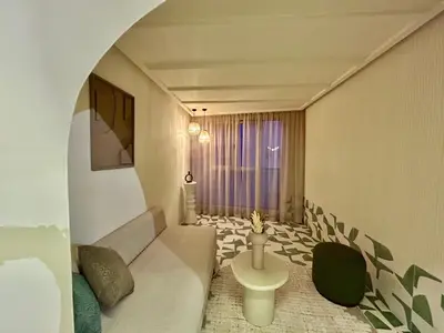 a small room with a bed and a window at Eden Vibes GUELIZ in Marrakech