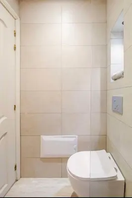 a bathroom with a white toilet and a shower at Eden Vibes GUELIZ in Marrakech