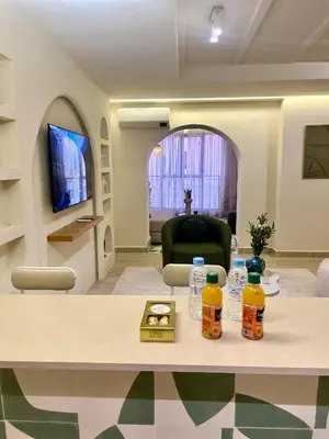 a living room with a table with drinks on it at Eden Vibes GUELIZ in Marrakech
