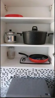 a pot on top of a stove in a kitchen at Kech Amal Apartment in Marrakech