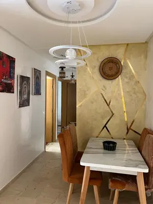 a dining room with a table and chairs at Marrakech Luxe & confort Appartement in Marrakech